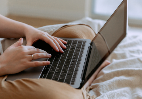 A person holing the laptop